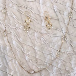 Long gold necklace with matching earrings